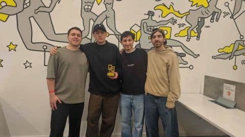 Four-person Vueltito team with the hackathon award